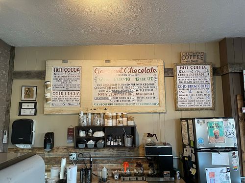 Display for drink options. Hot and cold coffee, non-dairy milk, and ice cream available. at Oh Mi Organics in St Johns