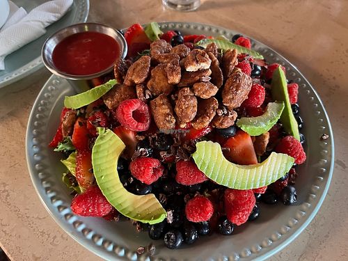 Frida Detroit salad: greens, berries, cacao nibs, candied pecans with raspberry vinaigrette & (avocado instead of goat cheese) at El Rincon De Frida in Jocotepec
