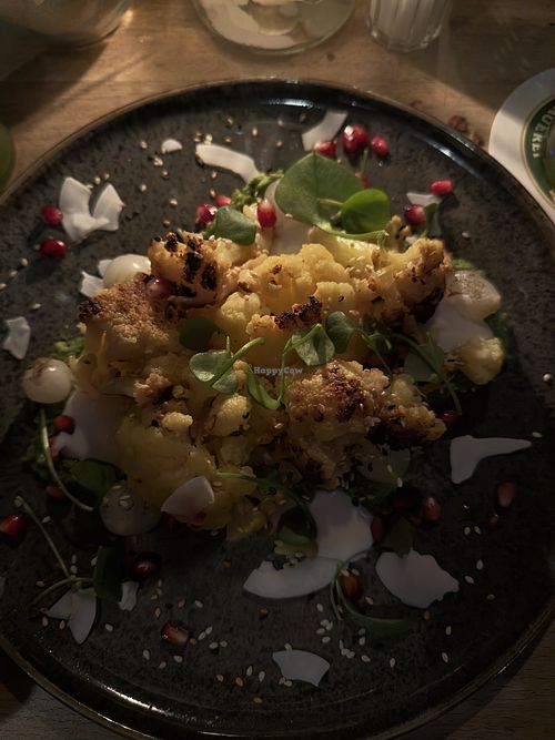 Cauliflower with salad, coconut, and pomegranate seeds   at Kaisergarten in Munich