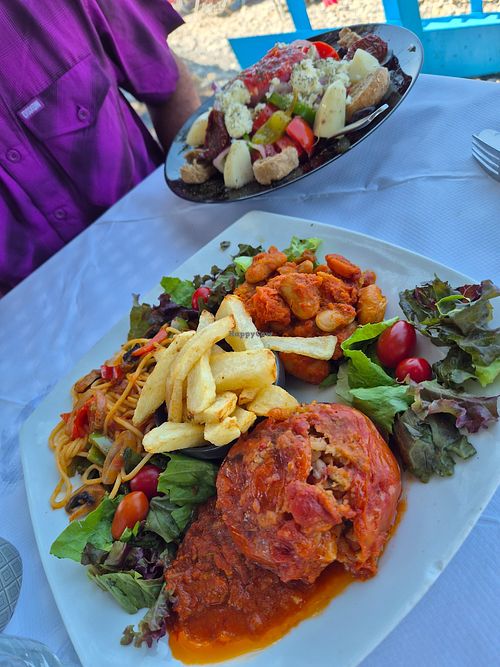 Mixed vegetarian plate with gemista, veggie spaghetti and giant beans at Taverna Maleme Beach Bar in Crete
