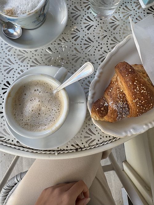 Cappuccino with soy milk (also oat milk available) and croissant with orange jam  at Caffè Letterario Dolceamaro in Lamezia Terme