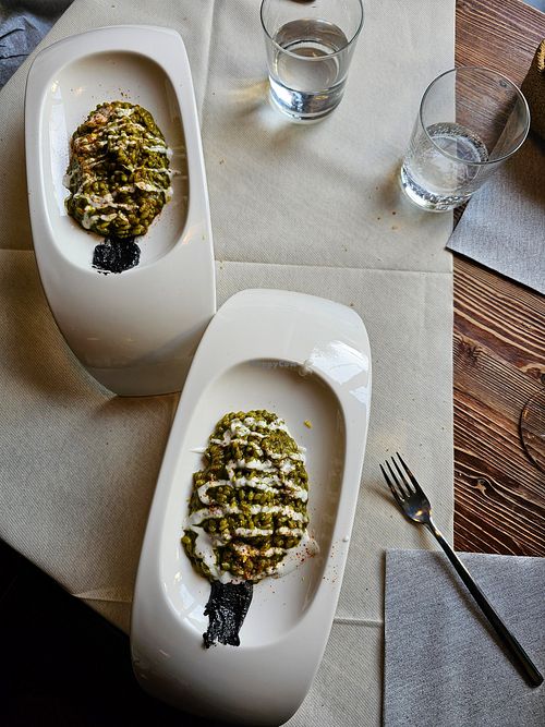 Risotto alla crema di spinaci con tajine nera e polvere di pomodori essiccati at Taverna Al Boccale in Portogruaro