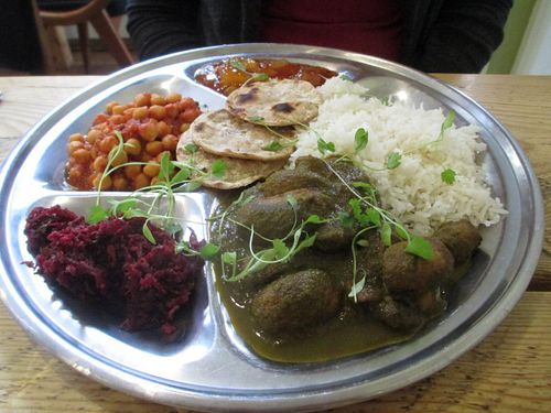 Thali of palak mushrooms, chana masala, beetroot pooriyal, chutney, basmati rice and chapati bread. at The Green Rocket Cafe in Bath