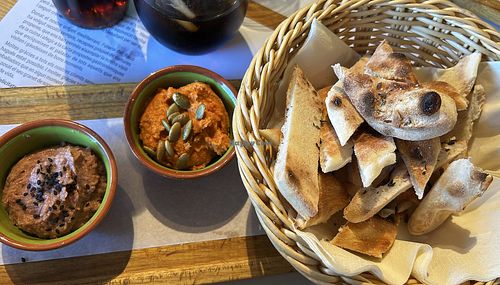 two kinds of hummus with bread  at El Racó in Palamos