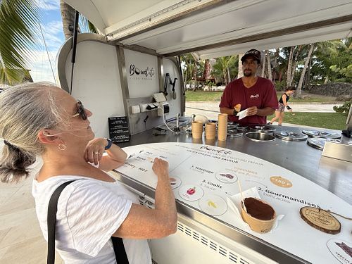 My wife ordering her ice cream   at Bount'iti in Tahiti