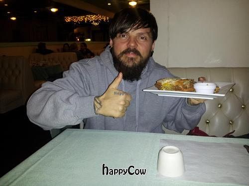 Happy with his Stomping Horse Seitan at Rawsheed's Raw Vegan Fusion in Granada Hills