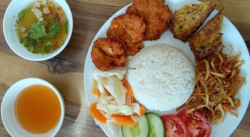 Broken rice grilled pork chop, pork skin, custard. Vegan. at Tinh Lac Quan in Inala
