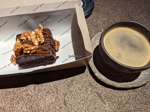 Cauliflower Mocha Brownie with coffee at Honest Greens - Gran de Gracia in Barcelona