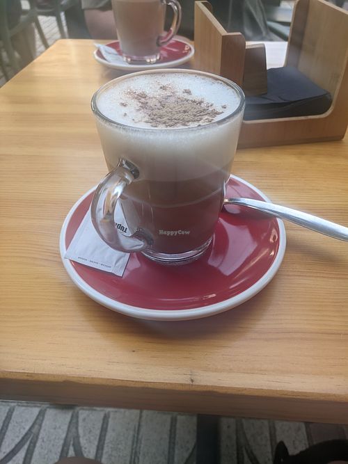 Oatmilk cappuccino at Loop Café in Tossa De Mar