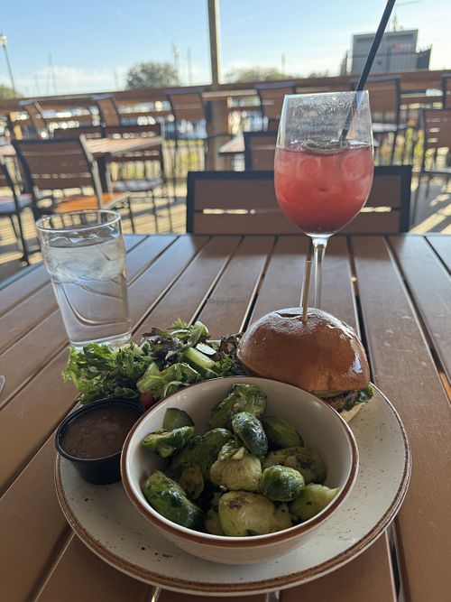 Black bean burger with Brussels sprouts and salad.  Purple haze cocktail was excellent too!    at The Mulberry House Brewery in Washington
