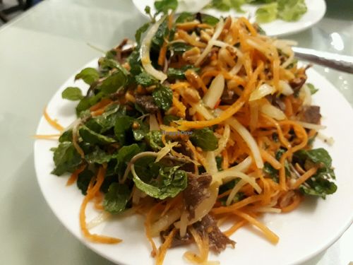 Carrot dish served with rice cracker at Karma Waters in Da Nang