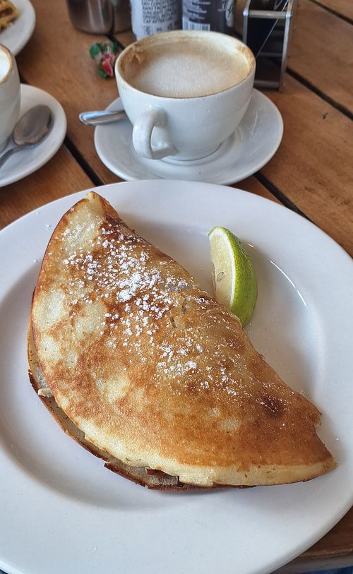 Egless pancake: fig preserve and pecan nuts. Capuccino with almond milk at Harrie's Pancakes in Graskop
