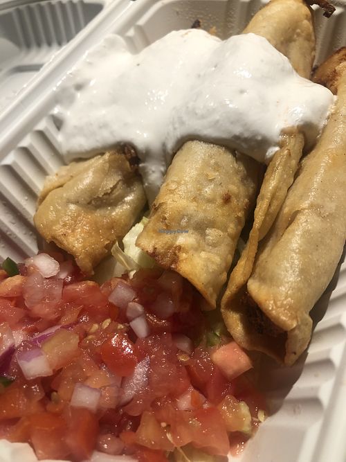 Flautas, the lettuce and tomatoes are separate and not easy to add in but they’re good without   at The Happy Hooligans in San Jose