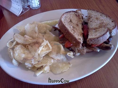 Italian Portabella & Fire Roasted Pepper Sandwich (ordered vegan - hold cheese on wheat)served with kettle chips and a pickle at Ganson's Neighborhood Bakery and Cafe in Rock Island