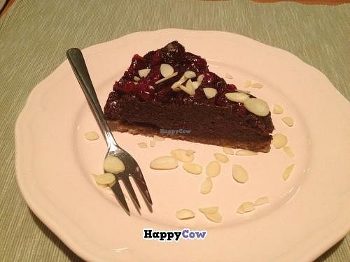 Chocolate cheesecake with berries and almonds at Pod Norenami in Krakow