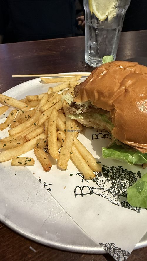 Veggie burger made vegan (with bite taken out of it)   at Bar Luca in Sydney