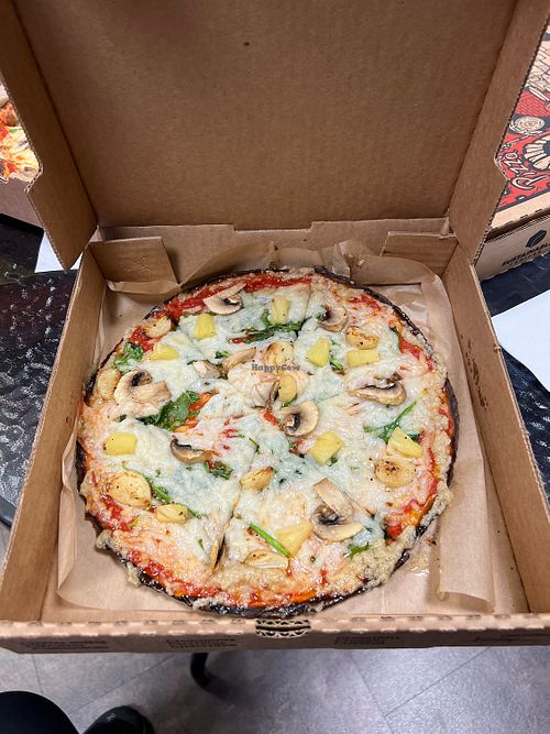Vegan pizza with pineapple, spinach, garlic and vegan cheese    at Firenza Kitchen in Lindenhurst