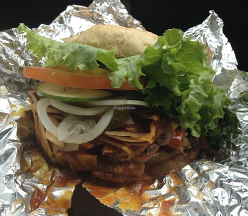 Philly cheeseburger + coconut bacon to go. 10/10  at Luv Burger in Samara