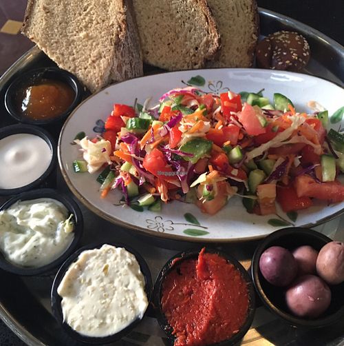 Homemade bread, sauces, salad and muffin at Meshek Barzilay in Tel Aviv