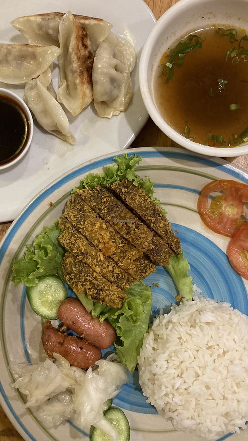 Vegan steak, rice and soup with a side of dumplings  at Surn Yi Vegetarian Restaurant in Phnom Penh