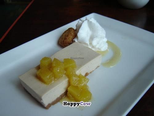 Vanilla bean cheesecake with pineapple compote, coconut whipped cream and a macaroon at The Grange in Providence