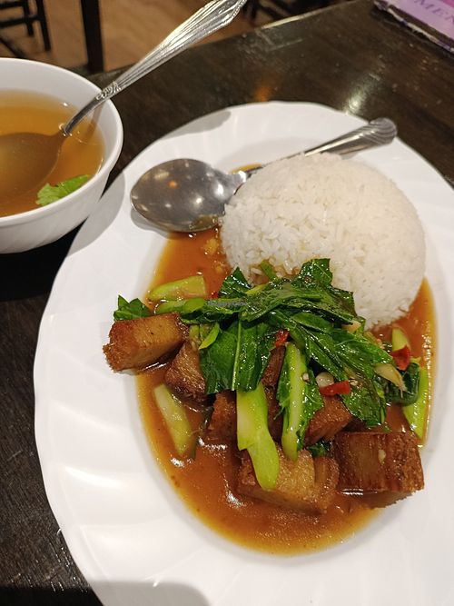Fried Kale and crispy soy pork. at Krua Boon - Silom - ครัวบุญ in Bangkok