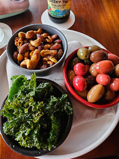 Fried kale, marinated olives, paprika nuts at Osprey's Restaurant in Oak Beach