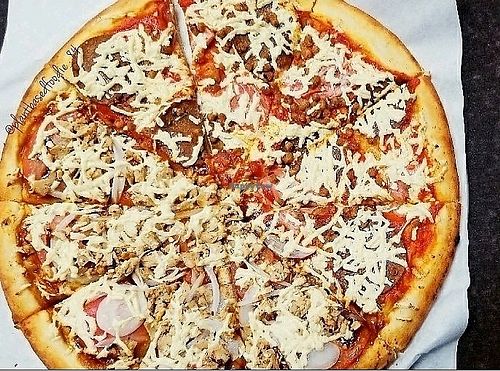 Large, half meat lover and BBQ chicken pizza at Vegan Pizza in Garden Grove