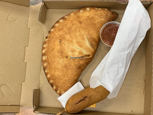 Vegan ham and cheese calzone and vegan corndog at Vegan Pizza in Garden Grove