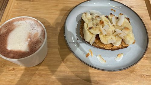 Hot oat chocolate with a piece of strawberry and banana toast  at The Kind  in Kyoto