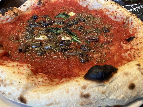 Pizza marinara with olives  at La Compagnia del Luppolo in Parabiago