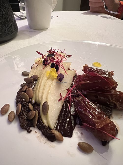Dessert of vanilla infused dates and sliced pears with pepitas and dark chocolate.    at Restaurant Beck in Depoe Bay