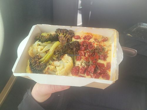 Hummus with roast veg. Very tasty. I don't usually like broccoli, but this was excellent! The semi-dried tomatoes made the whole thing so good. at Olivka in Almaty