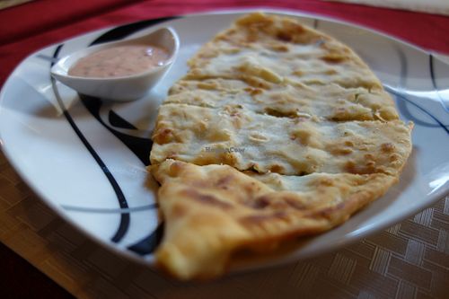 Bolani (flatbread with potatoes, leek, and fresh herbs) (vegan) at Weissberg Restaurant in Saarbrucken