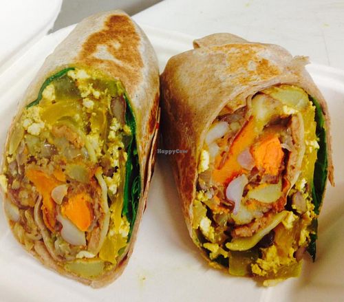 Organic Tex Mex Breakfast Burrito - Our savory scramble combines tofu, onions, red and green peppers, black beans, roasted root veggies and salsa. Wrapped in a whole wheat tortilla with baby spinach. Sriracha hot sauce available upon request. at The Randy Radish in Ashburn