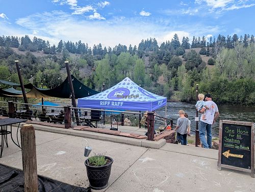 Riverfront seating and dog beach at Riff Raff Brewing Company in Pagosa Springs