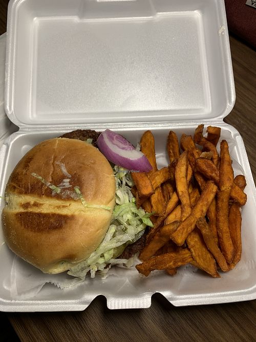 Impossible burger with sweet potato fries  at Orleans & York Deli in Moreno Valley