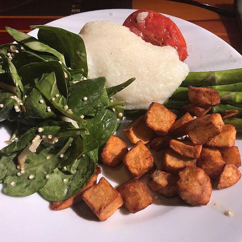 grilled tomato and asparagus with grits, spinach quinoa salad and home fries at Boma - Flavors of Africa in Lake Buena Vista