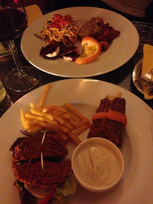 Degustation plates (sun burger with fries and mayo, zucchini spaghetti, raw wrap, beetroot ravioli with nut cheese, raw quiche with sun-dried tomatoes) at Secret of Raw in Prague