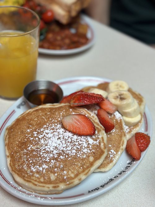 Pancakes with sirop strawberries and bananas   at The Breakfast Club in Chelmsford