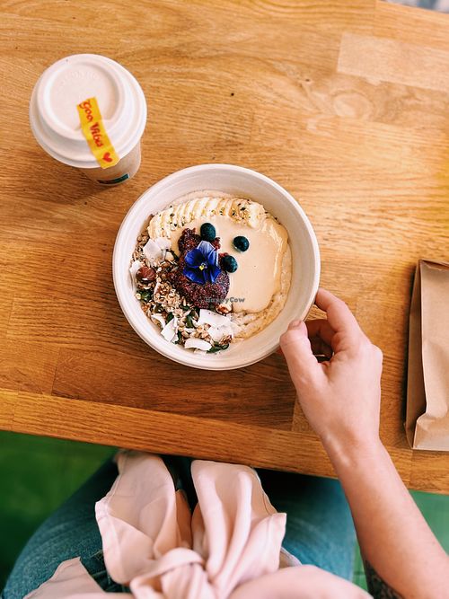 Oat Porridge with granola, banana, peanut butter & raspberry chia jam ✨✨✨ at The Vegan Fairies in Athens