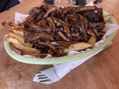 Vegan chorrillana with seitan and mushrooms  at Cerveza Rebelion in Chile Chico