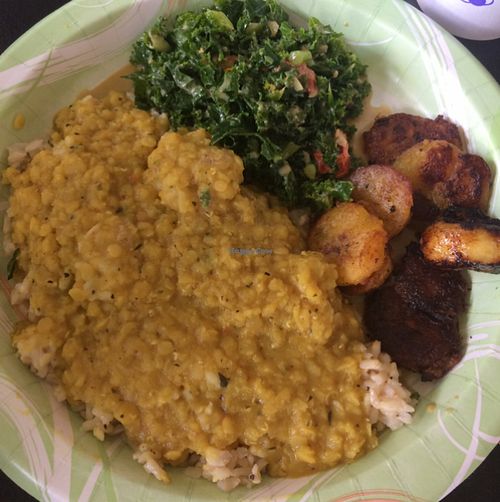 rice, curry, fried plantains and organic kale salad at Vegan Flava Cafe in Durham
