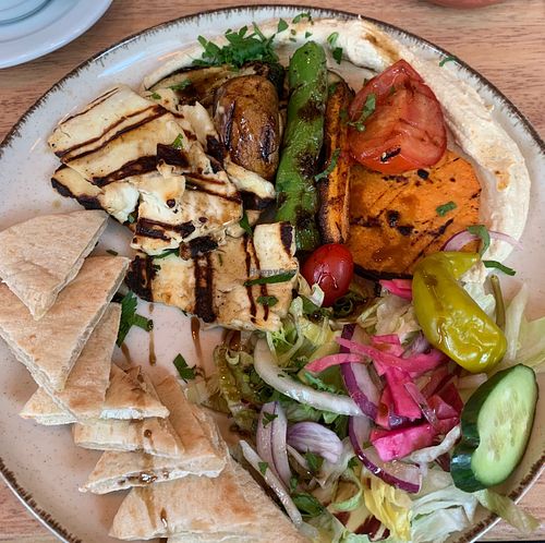 Photo of my order. A full plate of salad, grilled vegetables and Halloumi cheese, hummus, pita bread. at Lafal Food in Helsinki