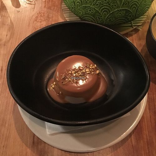 Panna cotta au lait de coco, vanille et amande avec sirop espresso at Invitation V in Montreal