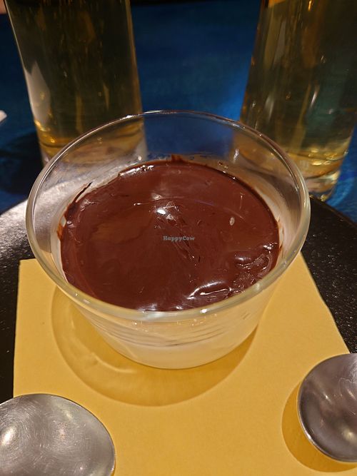 Pana Cotta with chocolate topping at Meow Pizzeria Verde in Innsbruck