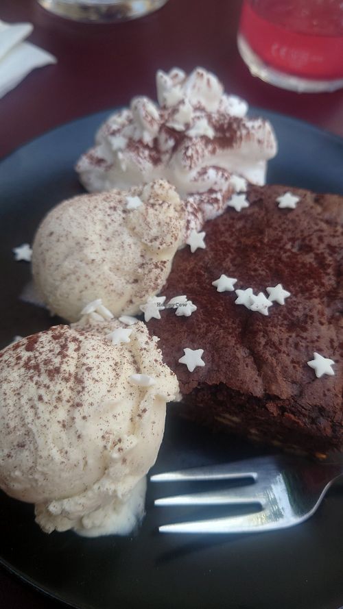 Brownie with vanilla ice cream scoops at Meow Pizzeria Verde in Innsbruck