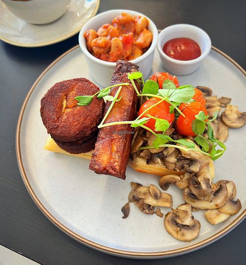 Vegan breakfast with lentil cakes and hash brown on a vegan waffle. Oat milk flat white and fresh juices  at Bar Hashery in York