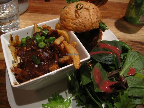 Cajun burger with a side salad. This is normally served with French fries, but you can transform your fries for a small vegan poutine for just a dollar or two. I really like this dish. at Lola Rosa - Parc in Montreal