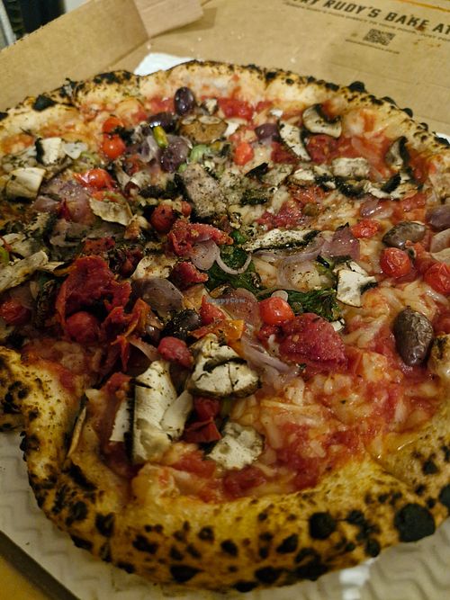 Tomato pizza, vegan cheese, mushrooms, onions, cherry tomatoes, chillis, cherry tomatoes. Delicious. at Rudy's Pizza Napoletana - Castle St in Liverpool